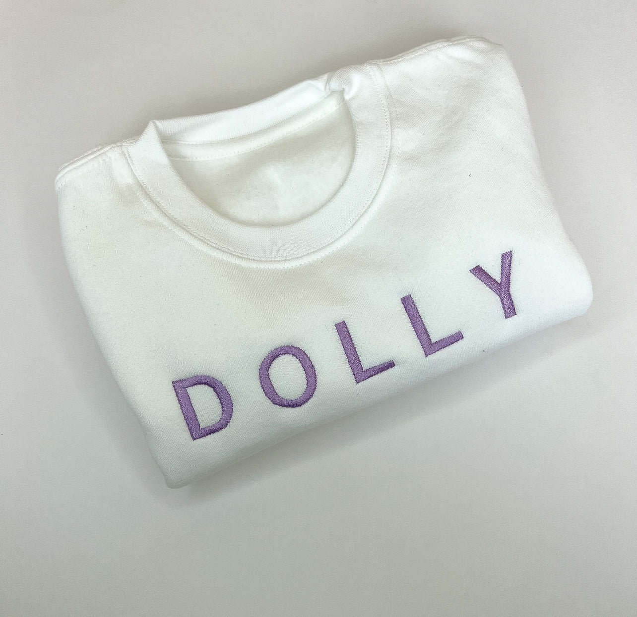 White jumper with Lilac Font