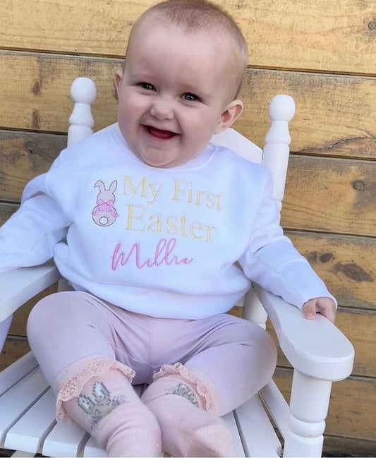Little girl wearing a my 1st Easter embroidered sweatshirt