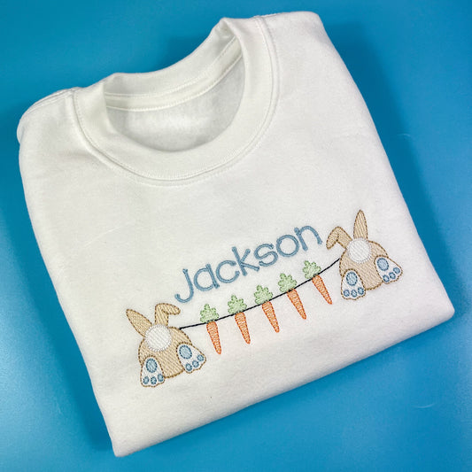 White jumper with Easter carrot bunting design embroidered on with child’s name