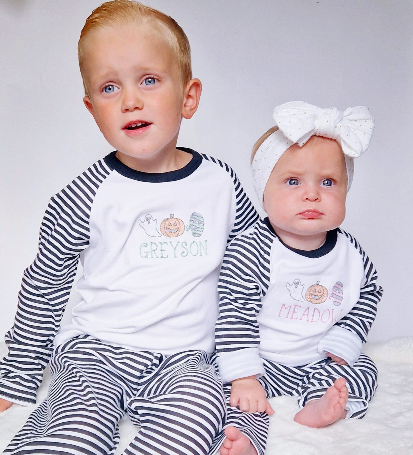 sketch design halloween pyjamas for girls and boys. embroidered with a ghost, mummy and pumpkin and finished with child's name
