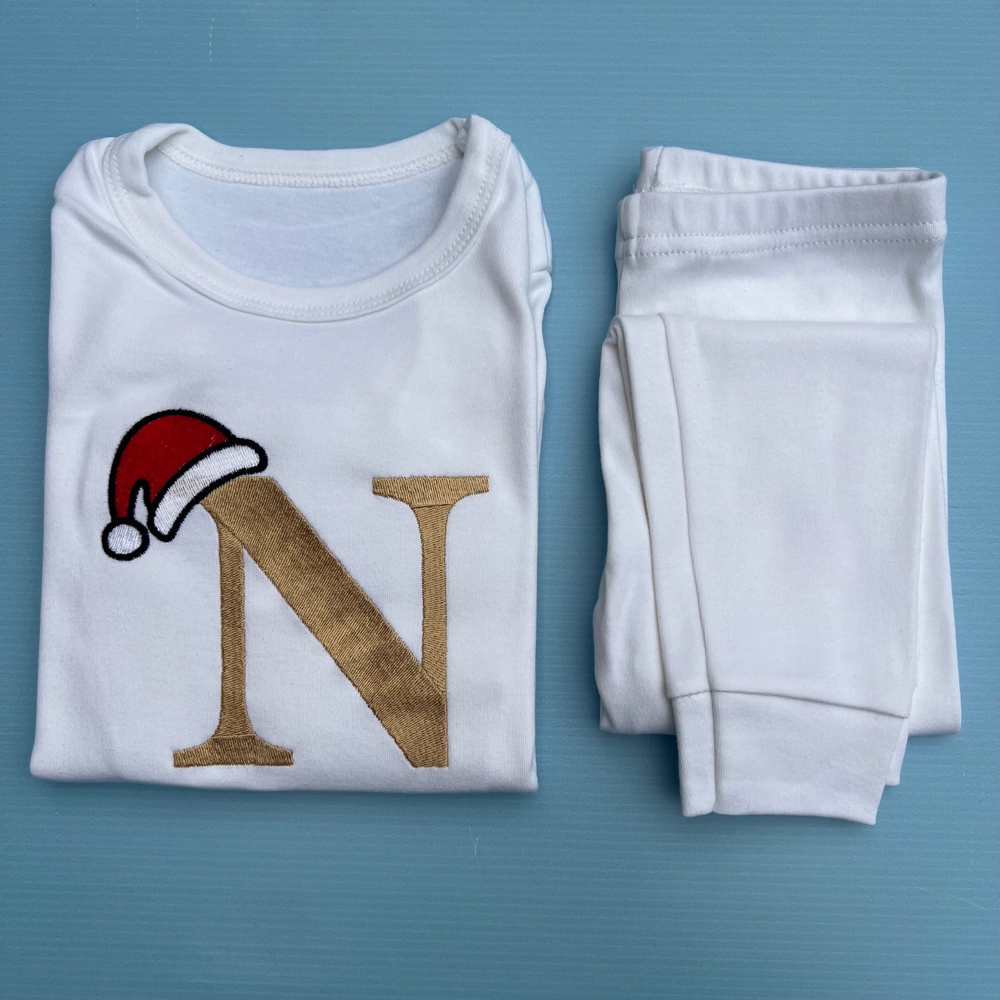 Beige initial with Santa Hat