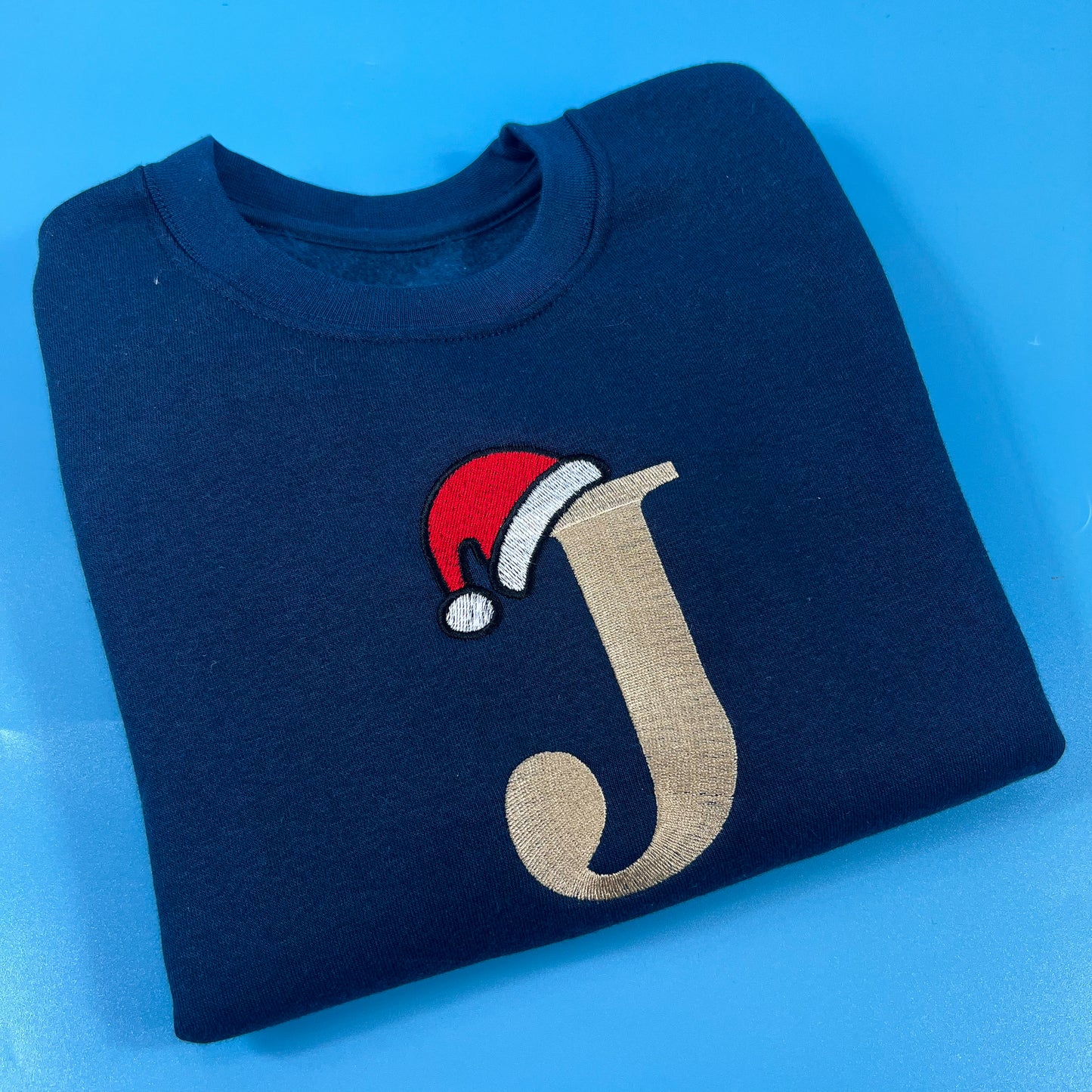 Navy sweatshirt with Inital and Santa Hat