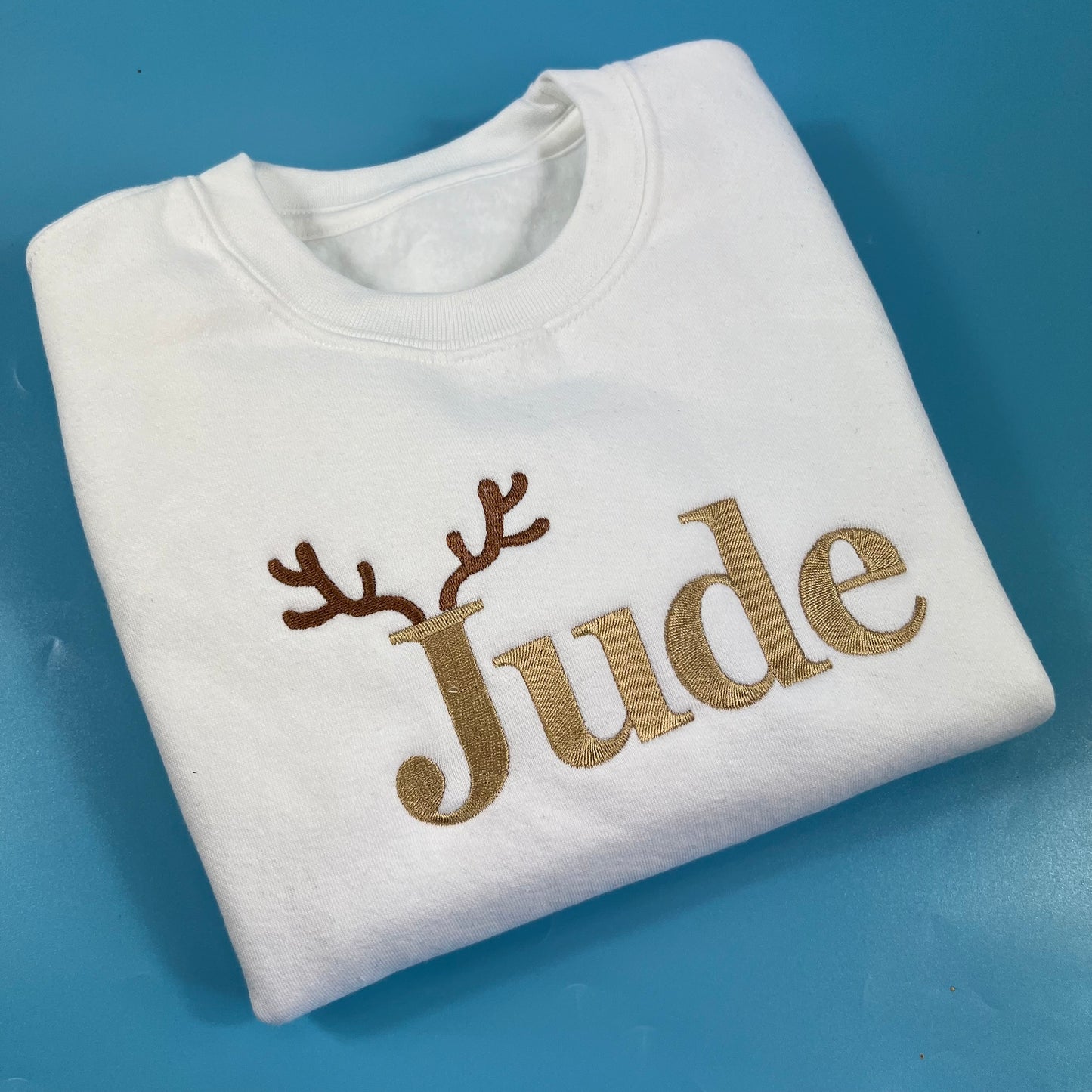 White sweatshirt with beige Name with Antlers