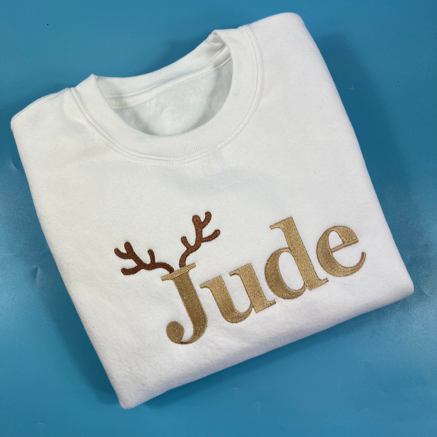 White sweatshirt with beige Name with Antlers