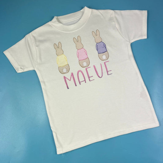 3 rabbits embroidered on a tshirt 
