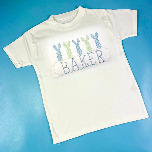 White Easter tshirt with embroidery of bunnies and child’s name 