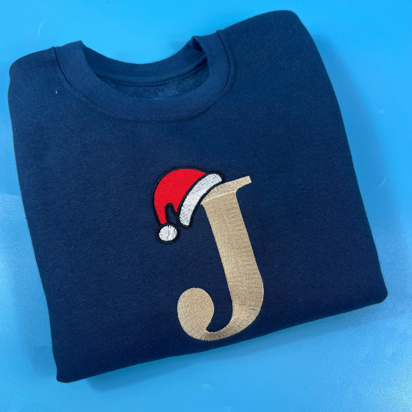 Navy sweatshirt with Inital and Santa Hat