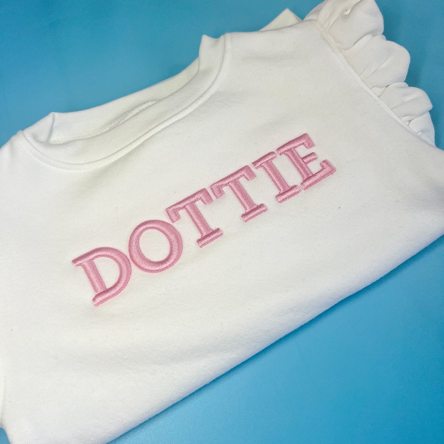 White Frill Jumper with Pink 3D Font Jumper