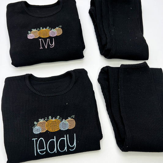 Black lounghwear with pumpkin design, 5 pumpkins with child name in embroidery